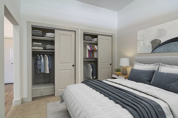 Cozy bedroom with stylish decor at Solis Gainesville Apartments, featuring luxury finishes and natural lighting