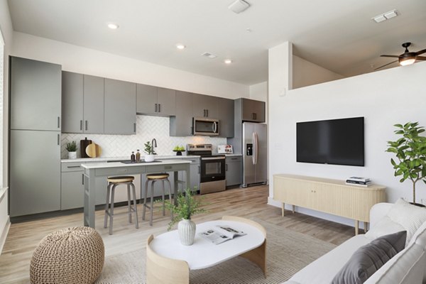 Open kitchen and living room with modern finishes at Solis Gainesville Apartments luxury residences