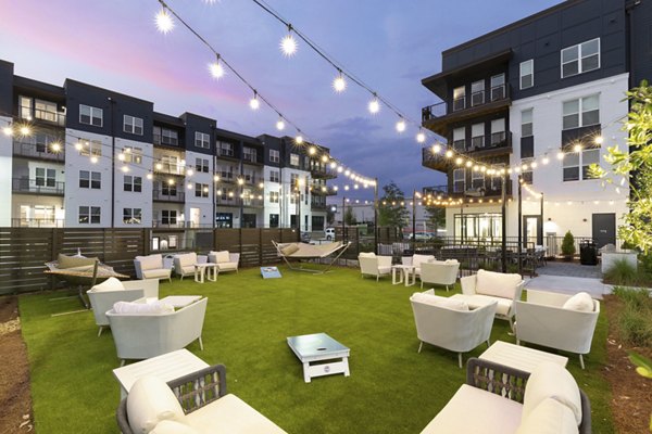 Outdoor recreational area with modern patio furniture at Solis Gainesville Apartments