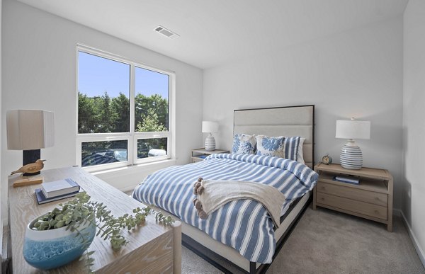 Spacious bedroom with modern decor at Riverside Wilton Apartments