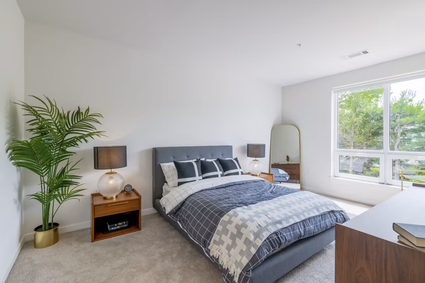 Luxurious bedroom with modern furnishings at Riverside Wilton Apartments