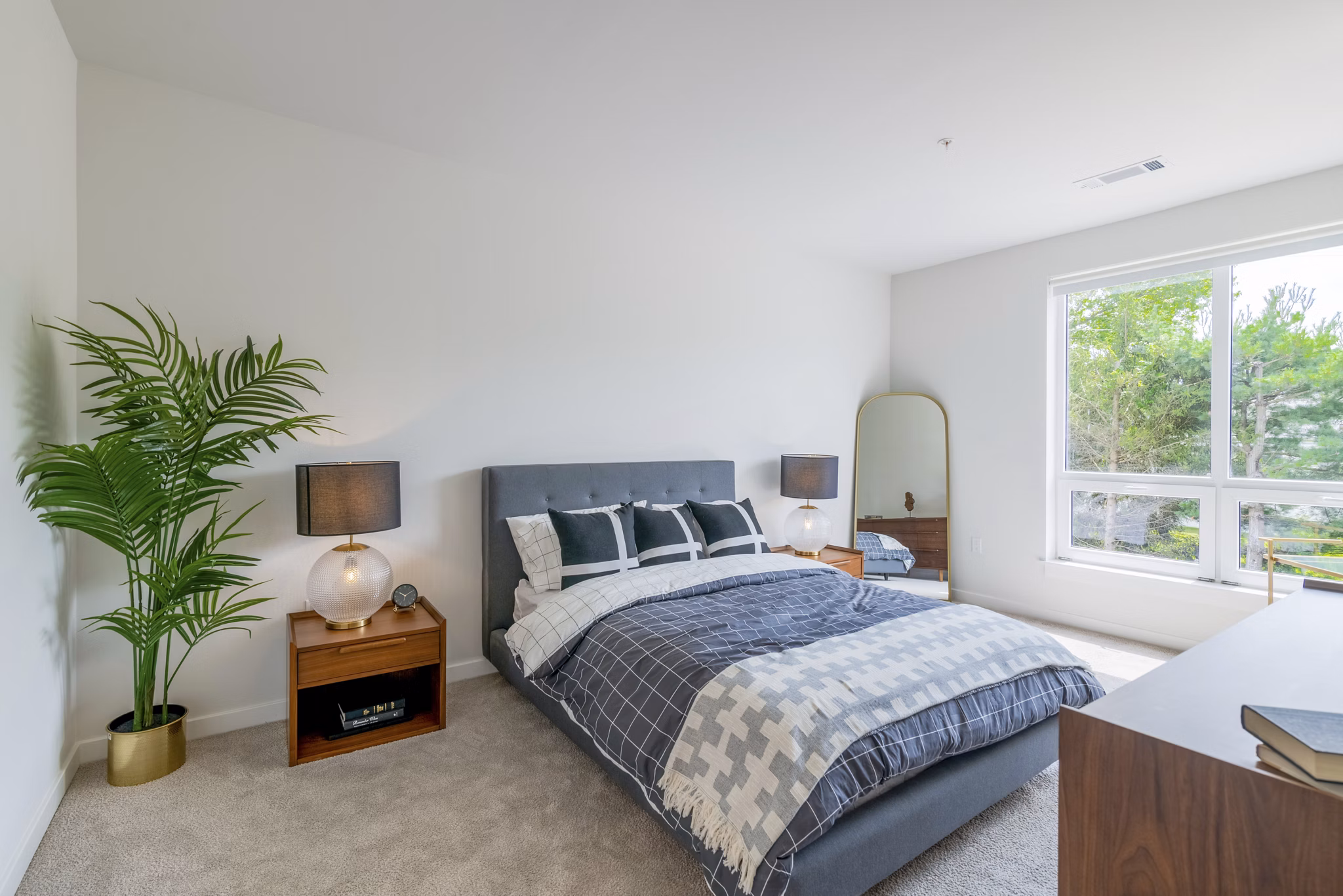 Luxurious bedroom with modern furnishings at Riverside Wilton Apartments