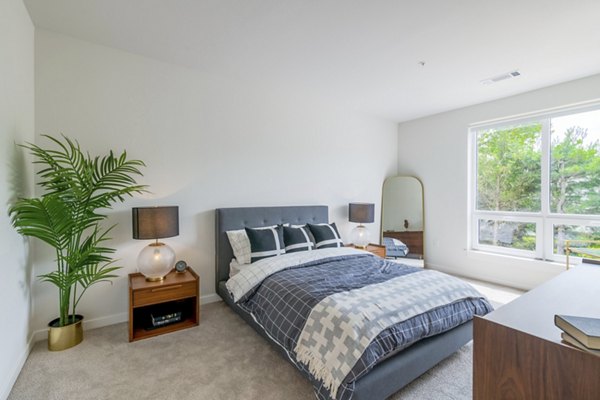 Luxurious bedroom with modern furnishings at Riverside Wilton Apartments