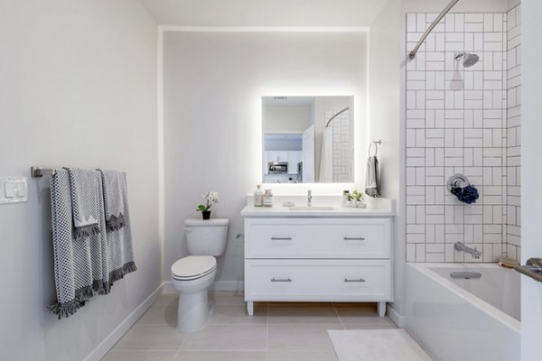 Modern bathroom with sleek fixtures at Riverside Wilton Apartments, offering luxury and comfort in a serene setting