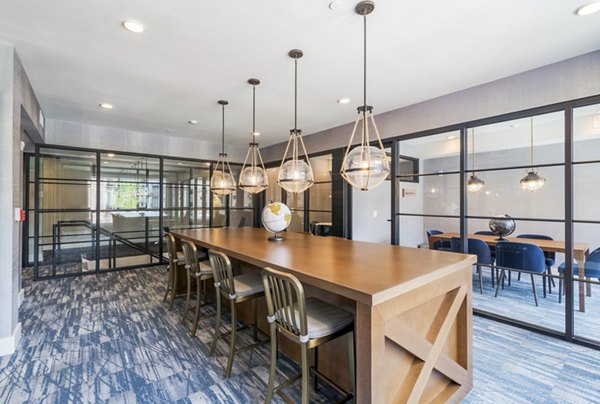 Clubhouse with modern design and ample seating at Riverside Wilton Apartments