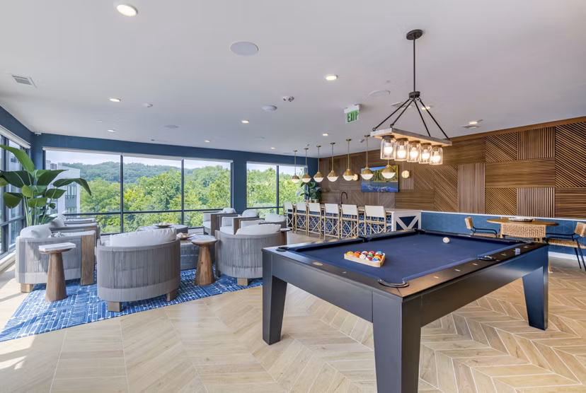 Clubhouse featuring modern seating and entertainment areas at Riverside Wilton Apartments