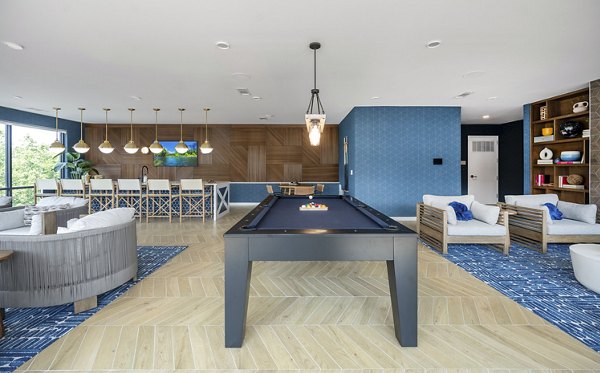 Clubhouse featuring modern design and comfortable seating at Riverside Wilton Apartments