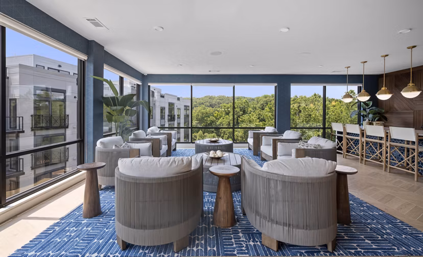 Clubhouse at Riverside Wilton Apartments: Modern communal space with plush seating and contemporary design for residents to enjoy