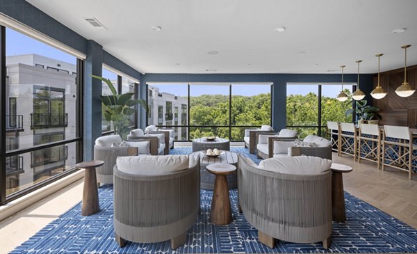 Clubhouse at Riverside Wilton Apartments: Modern communal space with plush seating and contemporary design for residents to enjoy
