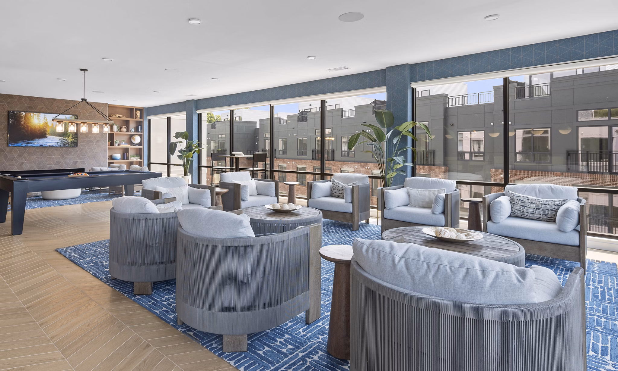 Elegant clubhouse at Riverside Wilton Apartments featuring modern decor and stylish seating areas
