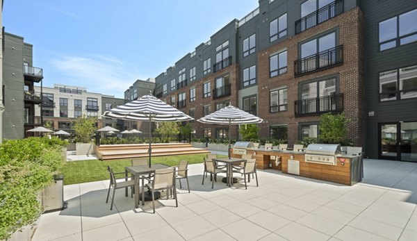 Clubhouse with modern furnishings at Riverside Wilton Apartments featuring luxury amenities for resident gatherings and events