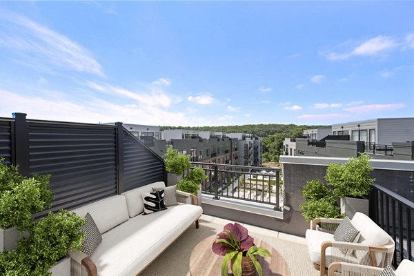 Elegant clubhouse with modern decor at Riverside Wilton Apartments, ideal for social gatherings and relaxation