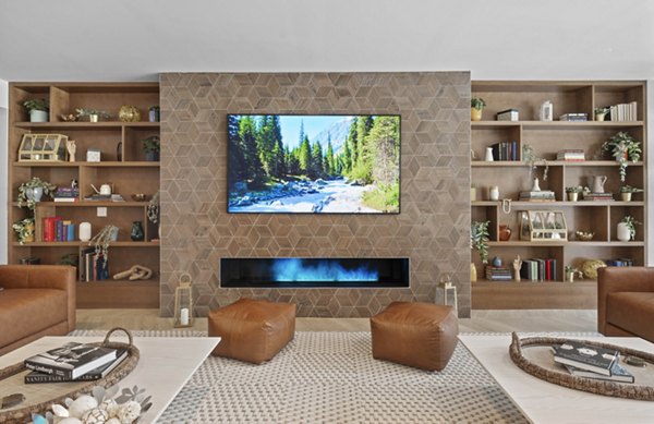 Modern living room featuring sleek furniture and large windows at Riverside Wilton Apartments