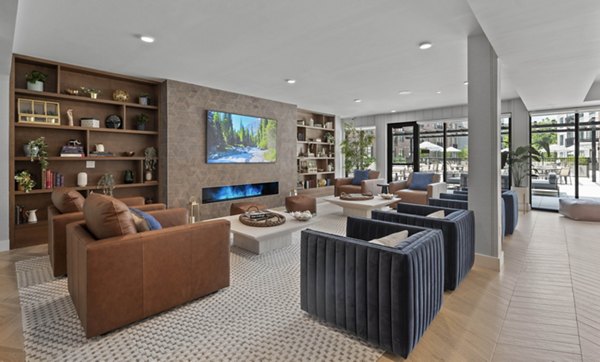 Spacious living room with contemporary design at Riverside Wilton Apartments featuring luxury furnishings and abundant natural light
