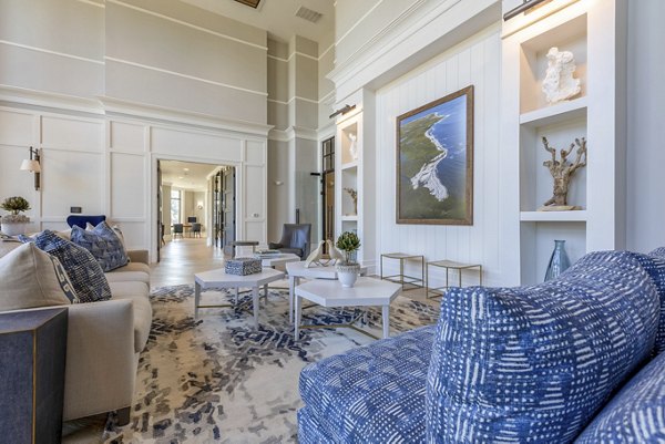 Clubhouse with modern design and comfortable seating at Newbrook Point Hope Apartments, ideal for gatherings and community events