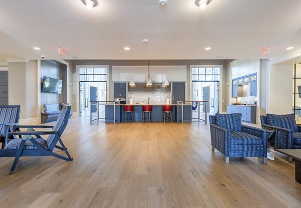 Modern clubhouse featuring community lounge and event space at Newbrook Point Hope Apartments