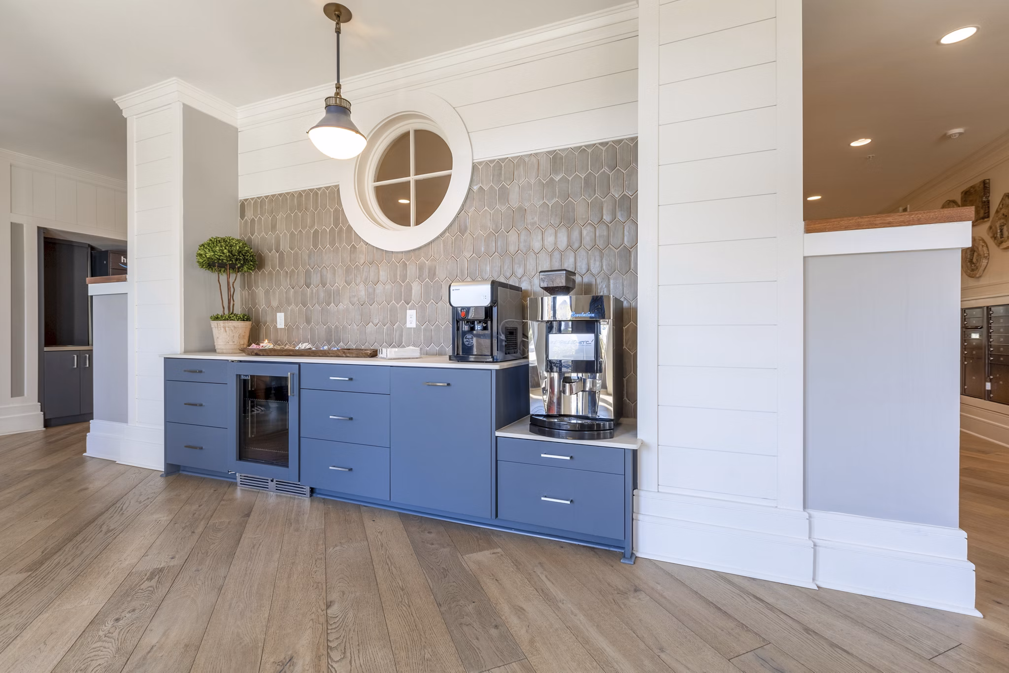 Clubhouse with modern design and cozy seating at Newbrook Point Hope Apartments featuring social spaces and entertainment areas