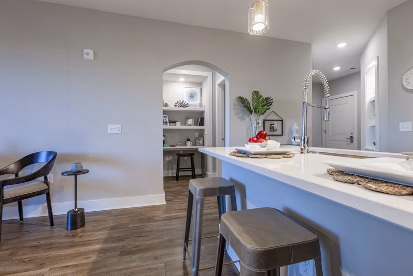 Contemporary dining area with elegant lighting at Newbrook Point Hope Apartments in Charleston, luxury living by Greystar