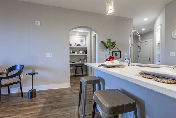 Contemporary dining area with elegant lighting at Newbrook Point Hope Apartments in Charleston, luxury living by Greystar