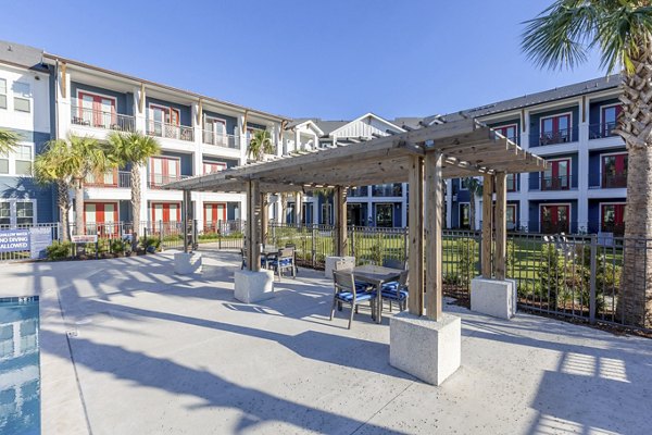 Patio with stylish outdoor furniture at Newbrook Point Hope Apartments