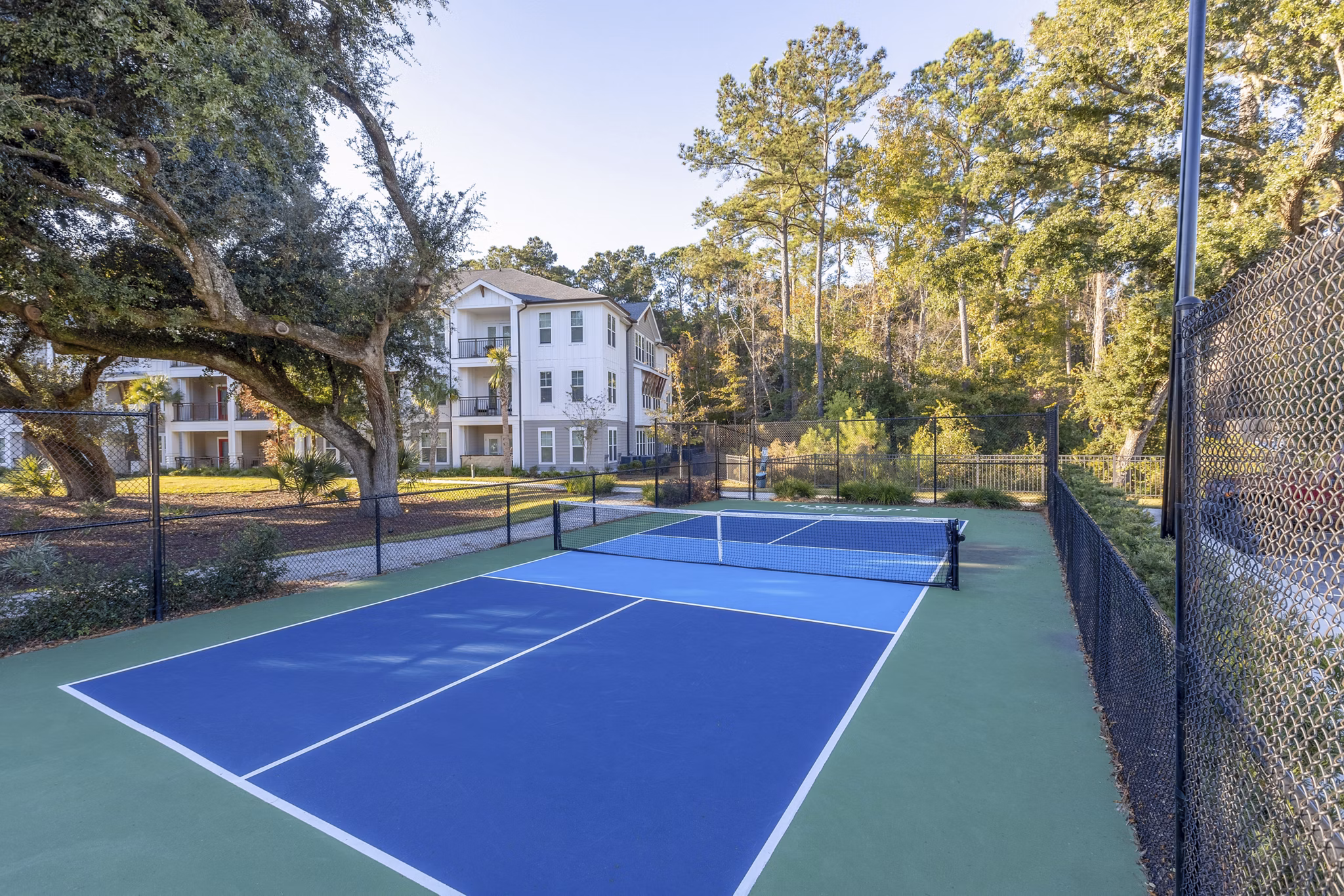 Sport court for basketball and tennis at Newbrook Point Hope Apartments, featuring modern designs and amenities for active living