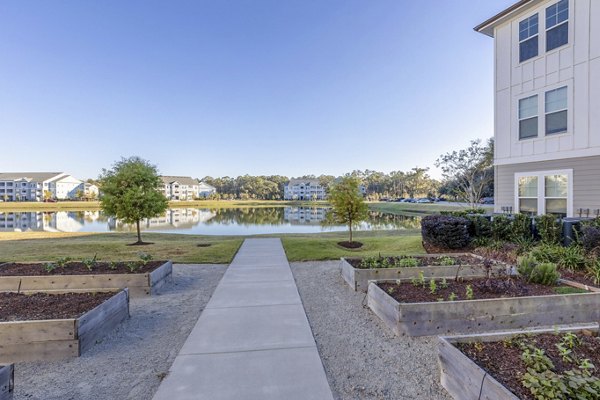 Serene courtyard with lush greenery at Newbrook Point Hope Apartments