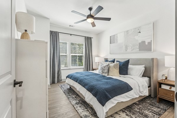 Spacious bedroom with modern furnishings at Waterside at Pepper Hall Apartments in Canada showcasing Greystar's luxury apartment features