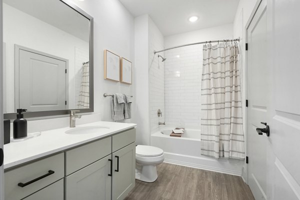 Bathroom with elegant modern fixtures at Waterside at Pepper Hall Apartments