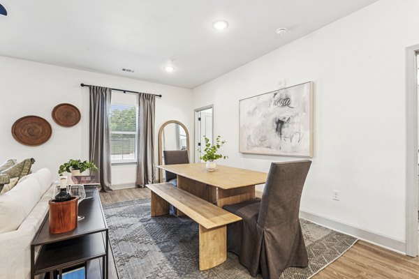 Elegant dining room with contemporary furniture at Waterside at Pepper Hall Apartments