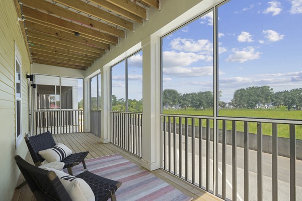 Spacious patio with modern furniture at Waterside at Pepper Hall Apartments offering luxury outdoor living spaces