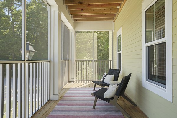 Modern patio with stylish seating at Waterside at Pepper Hall Apartments