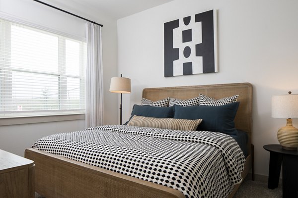 Bedroom featuring cozy decor and elegant lighting at Broadstone Frontera Ridge Apartments Perfect blend of comfort and style in luxury living