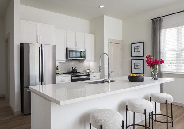 Modern kitchen with stainless steel appliances at Broadstone Frontera Ridge Apartments