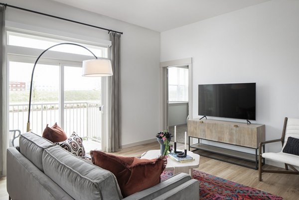 Living room featuring modern furnishings and hardwood floors at Broadstone Frontera Ridge Apartments