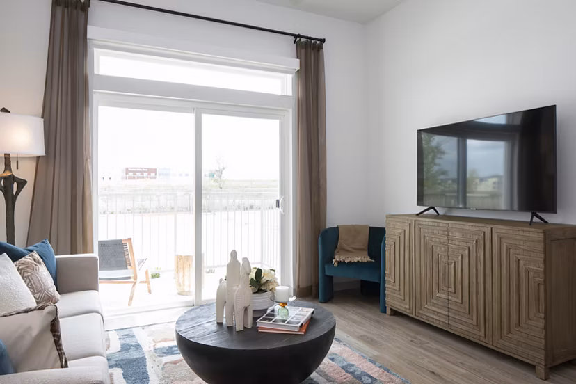 Spacious living room with modern design and natural light in Broadstone Frontera Ridge Apartments