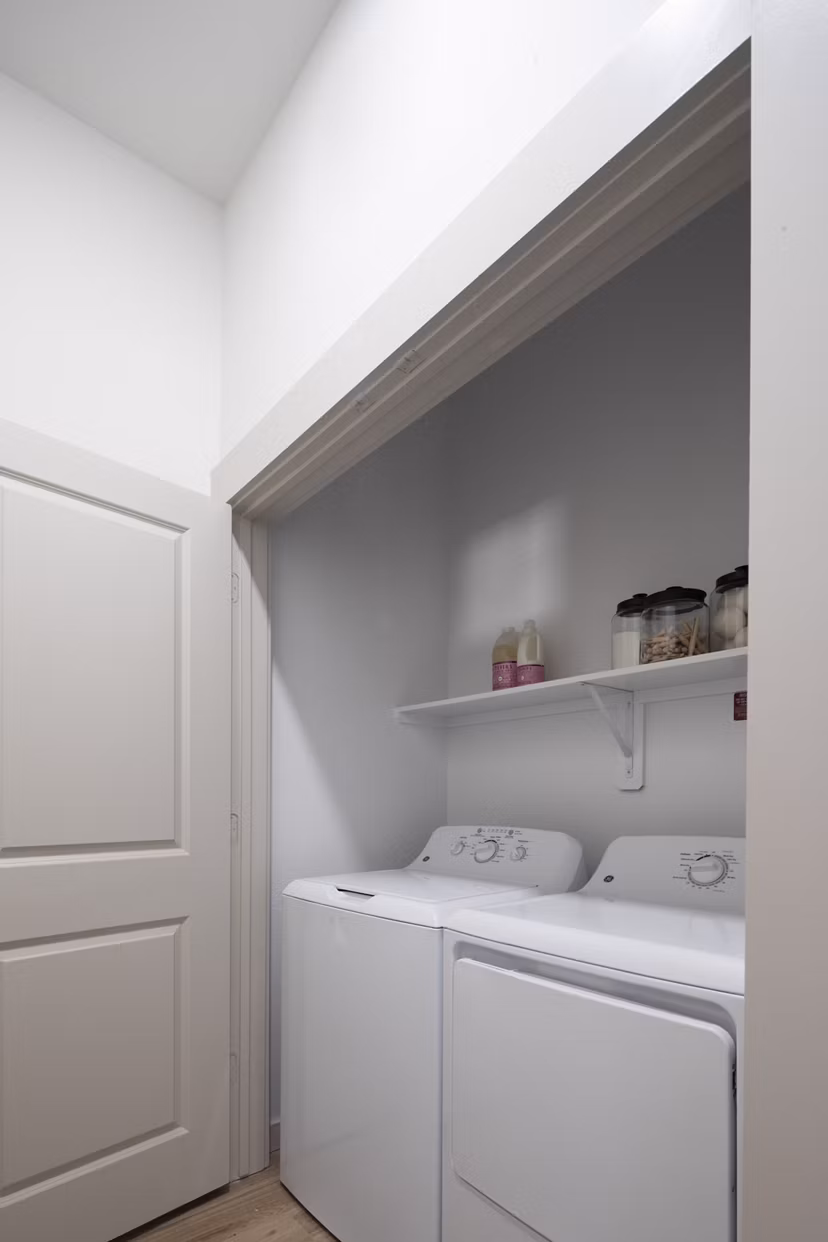 Laundry room with modern appliances at Broadstone Frontera Ridge Apartments