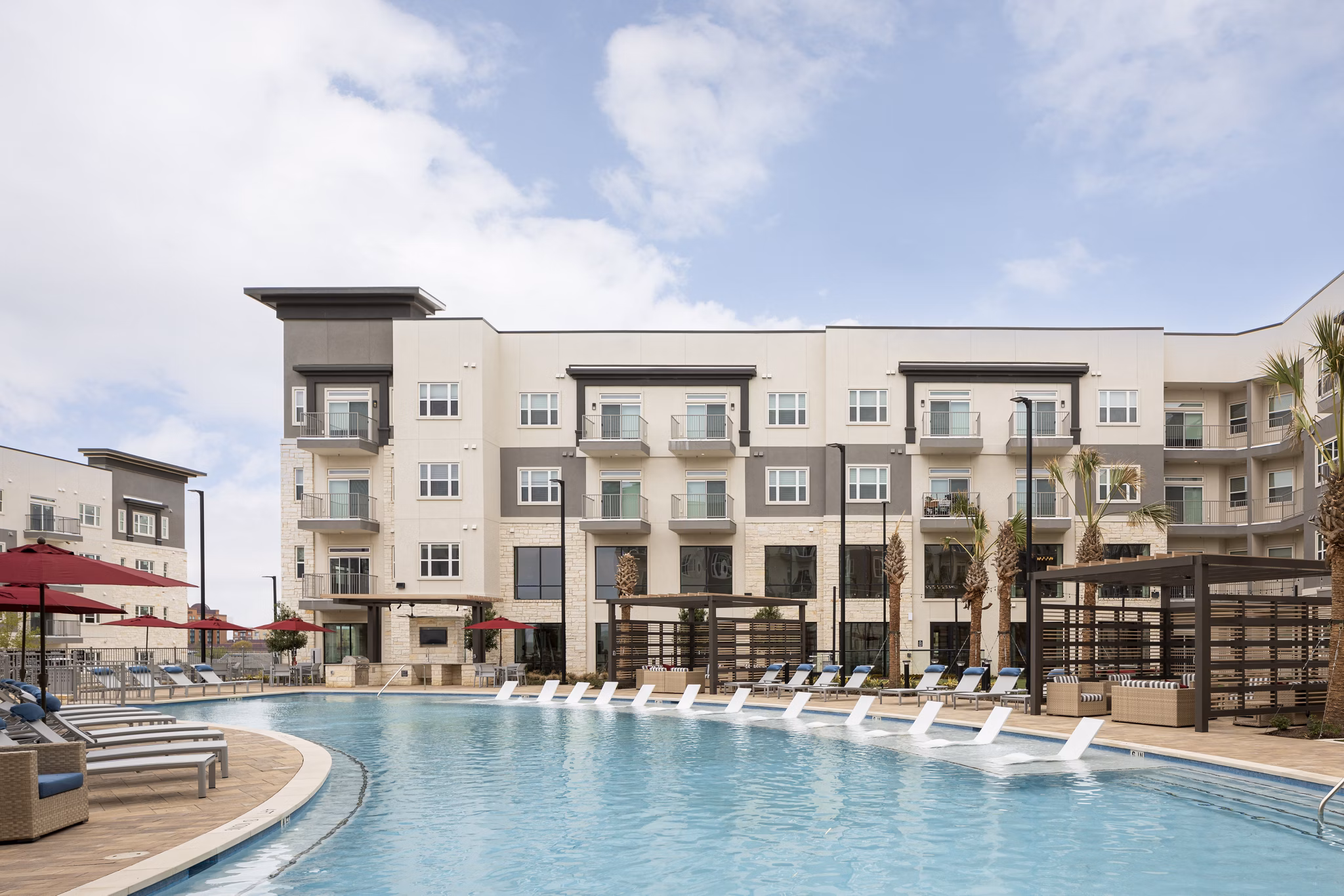 Stylish pool with lounge chairs at Broadstone Frontera Ridge Apartments, an upscale community for relaxation and leisure
