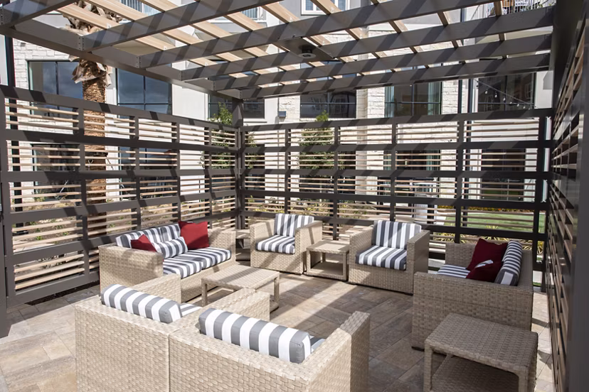 Courtyard with landscaped gardens at Broadstone Frontera Ridge Apartments, ideal for relaxation and community events