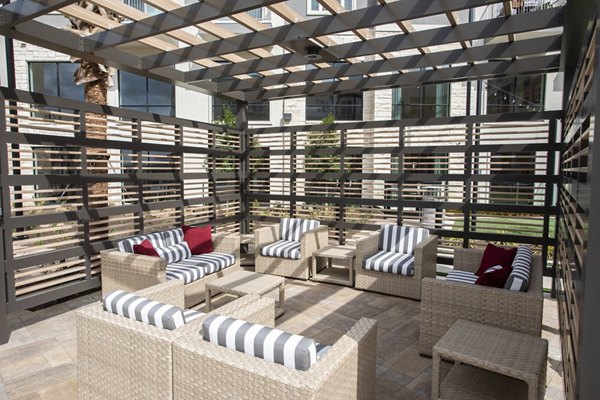 Courtyard with landscaped gardens at Broadstone Frontera Ridge Apartments, ideal for relaxation and community events
