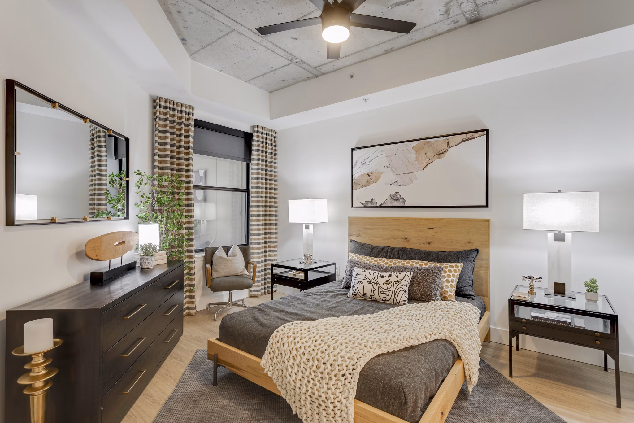 Cozy bedroom with modern decor at Elliston 23 Apartments, luxury living in Nashville Ideal for comfort and style seekers