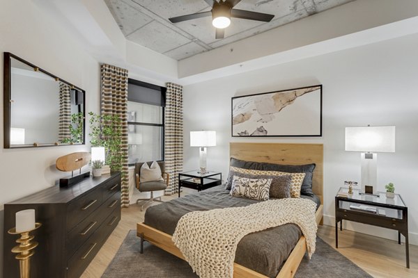 Cozy bedroom with modern decor at Elliston 23 Apartments, luxury living in Nashville Ideal for comfort and style seekers