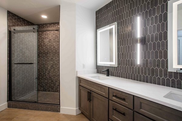 Modern bathroom with sleek fixtures at Elliston 23 Apartments, a Greystar property offering luxury living and contemporary design elements