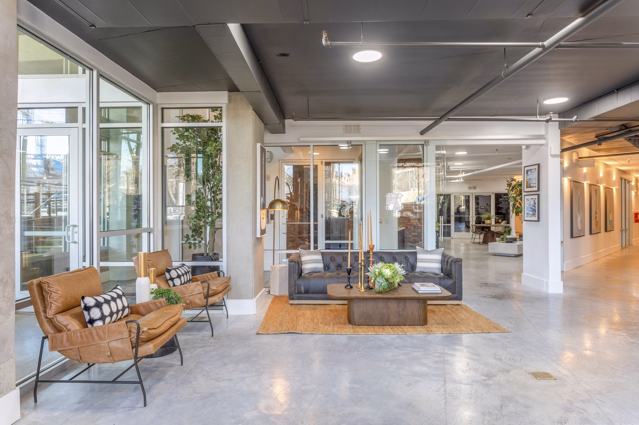 Clubhouse featuring modern lounge areas and games at Elliston 23 Apartments