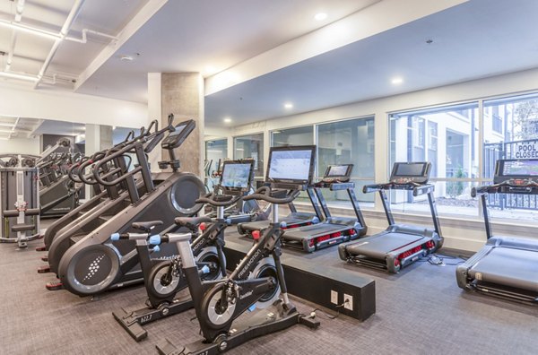 Modern fitness center with state-of-the-art equipment at Elliston 23 Apartments