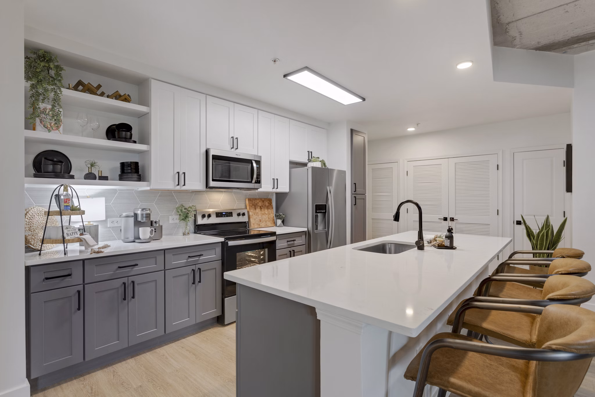 Modern kitchen with stainless steel appliances at Elliston 23 Apartments