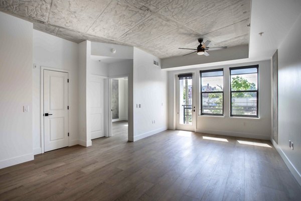 Spacious living room with modern decor at Elliston 23 Apartments, luxury community with premium amenities