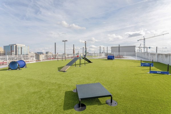 Scenic dog park with agility equipment at Elliston 23 Apartments, a Greystar luxury community in Nashville, perfect for pet-friendly living