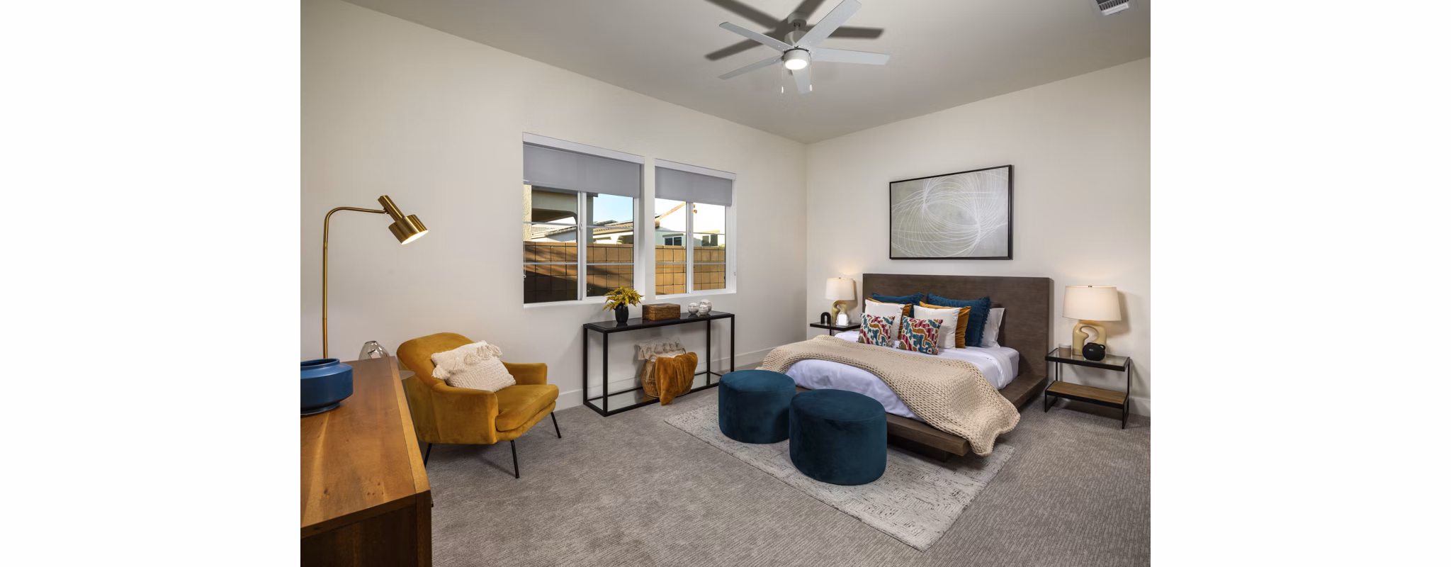 Cozy bedroom with modern furniture and large windows at SolTerra Apartments