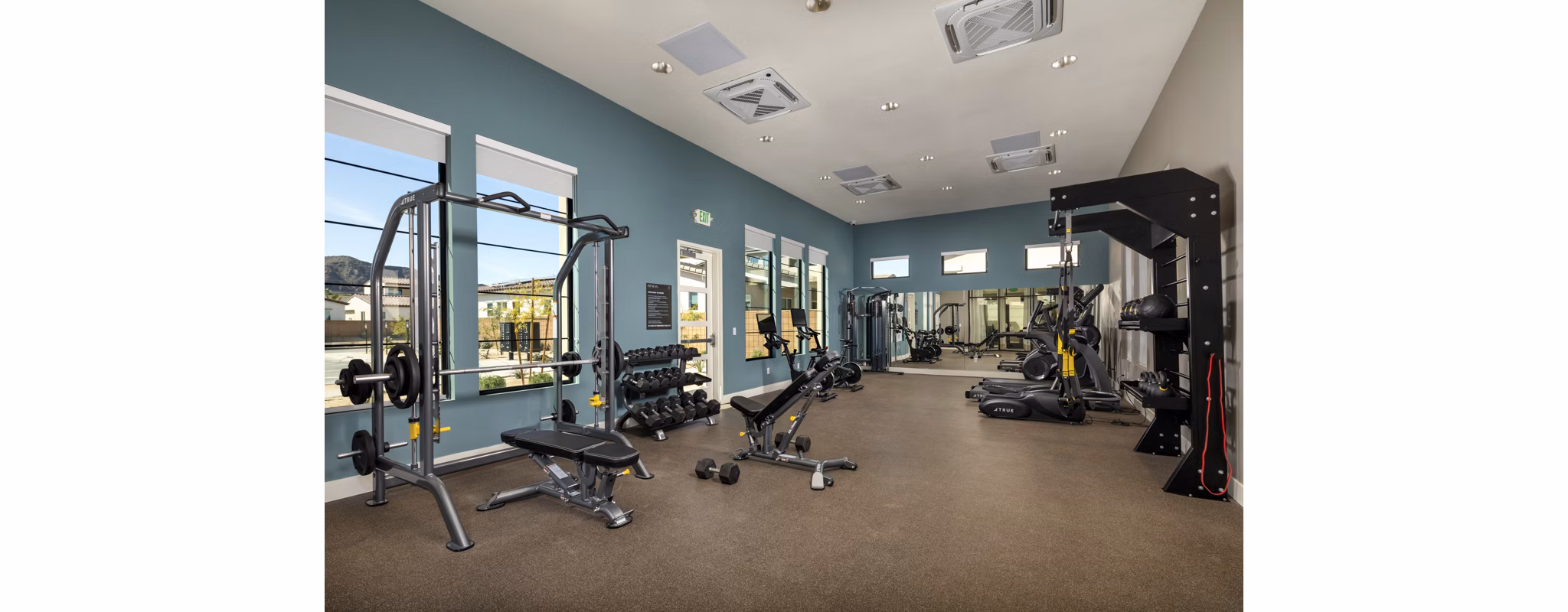 Well-equipped fitness center with modern exercise machines at SolTerra Apartments