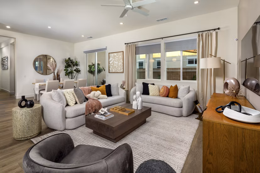 Living room with sleek furniture and large windows at SolTerra Apartments, luxury Greystar property